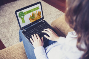 Woman visiting website on her laptop