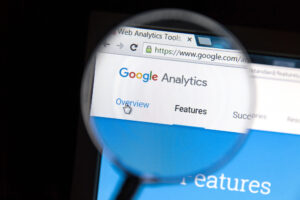 Magnifying glass looking at google analytics