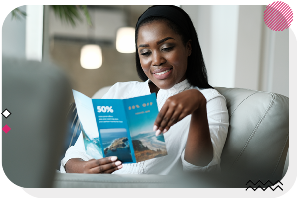 Woman holding a brochure and reading it